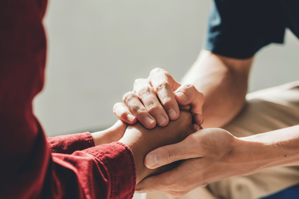 Holding hands during time of grieving
