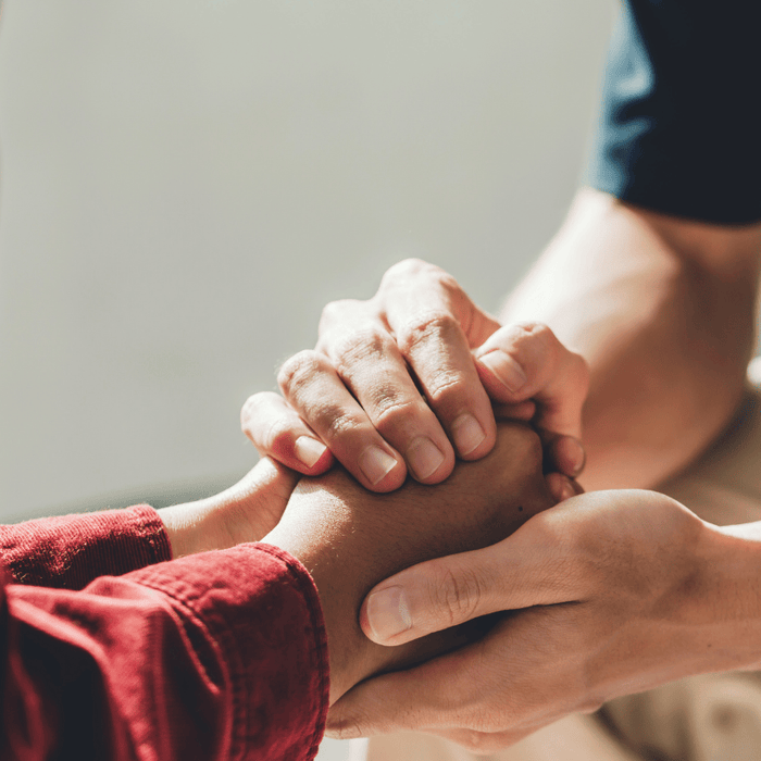 Holding hands during time of grieving