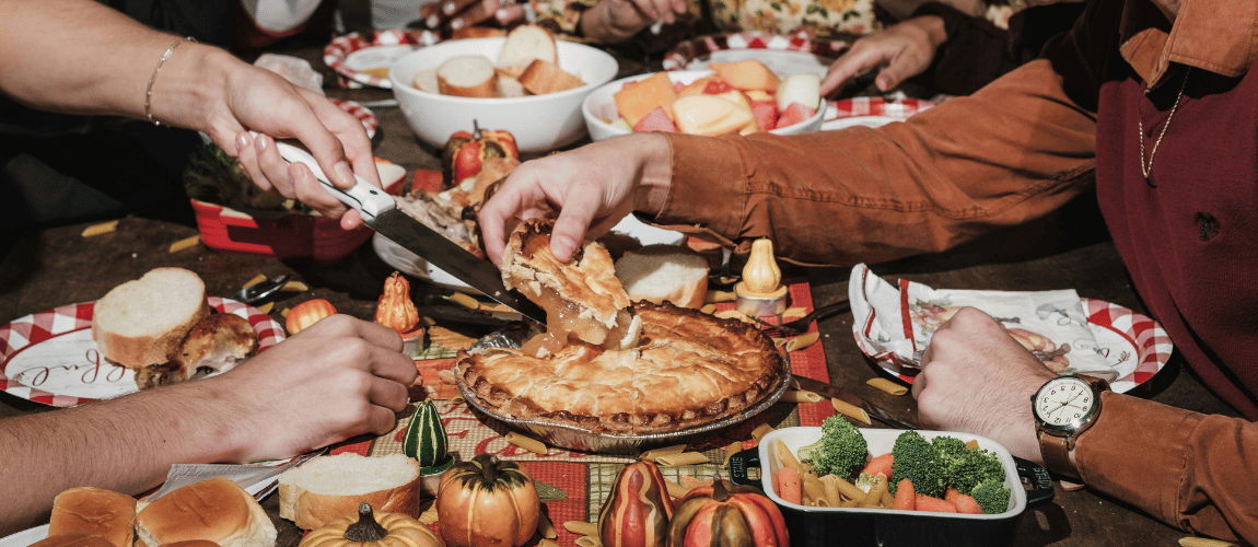Thanksgiving table with food and family