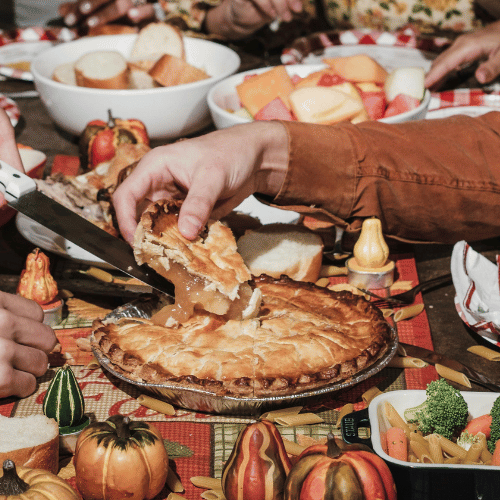 Thanksgiving table with food and family