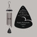 Wind chime with engraved Retirement message on a gray background featuring the retiree's name and year