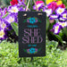 Decorative sign with 'Taylor's SHE SHED EST. 2025' text, surrounded by colorful flowers.