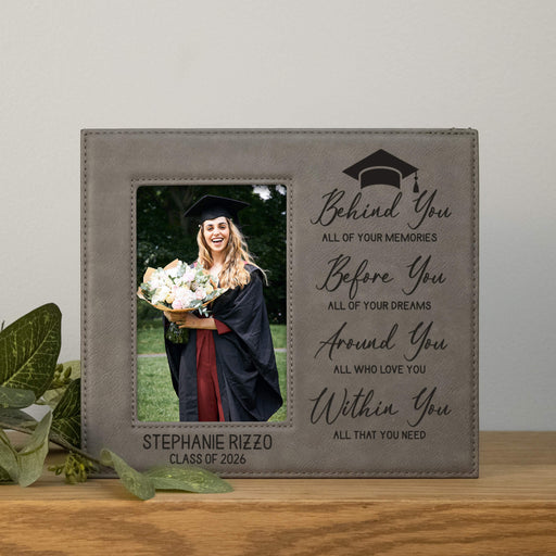 Graduation-themed photo frame with engraved text and a photo of a graduate holding flowers.