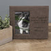 Memorial photo frame with a rabbit picture and text on a wooden surface.