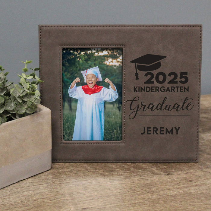gray leather frame with '2025 Kindergarten Graduate Jeremy' text and a photo of a child in graduation attire.
