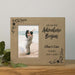 Beige photo frame with 'And so our Adventure Begins' text and a couple on a beach
