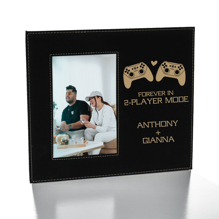 black and gold video game controller picture frame