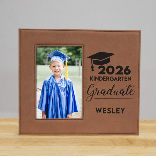 Graduation-themed photo frame with a picture of a kindergarten graduate and engraved text.