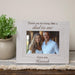Personalized photo frame with a picture of a stepfather and daughter and engraved text on a wooden surface.