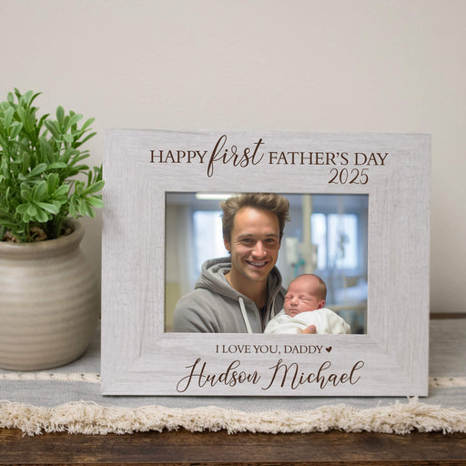 Personalized photo frame for the first Father's Day with a photo of a man holding a baby.