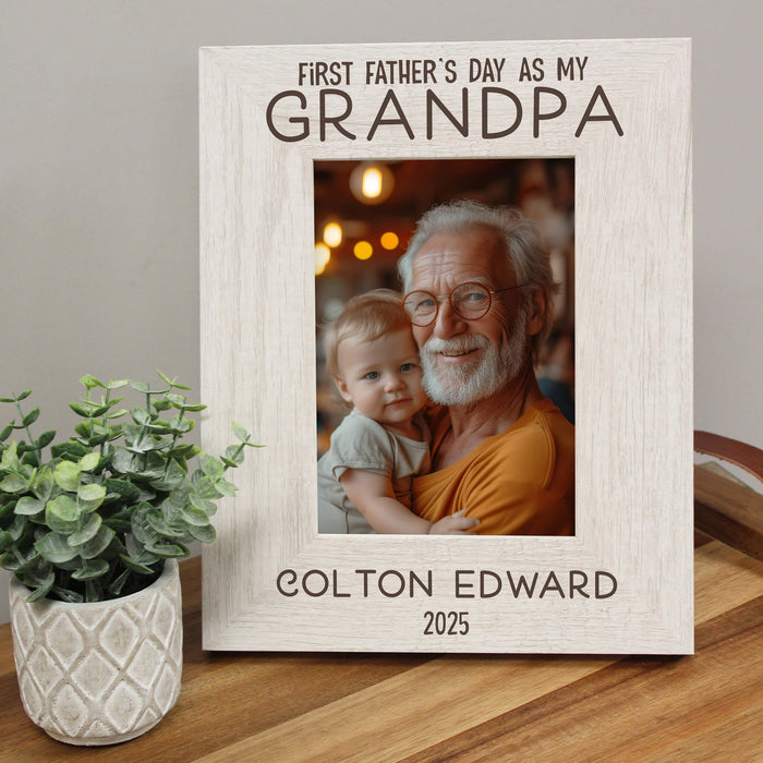 Personalized photo frame for Grandpa on First Father's Day, featuring a photo of an older man holding a baby.