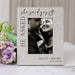 Personalized photo frame with 'she said yes' text and a couple's photo, surrounded by flowers.