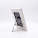Back of a wooden picture frame on a white background