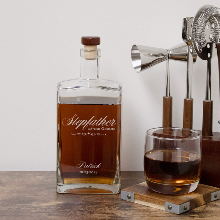 Personalized whiskey bottle with glass and bar tools on a wooden surface