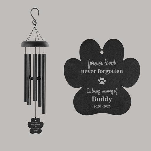 Black wind chime and paw-shaped sail with personalized name and years of life on a gray background