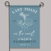 Garden flag with 'Last Toast on the Coast' design and text on a blue background