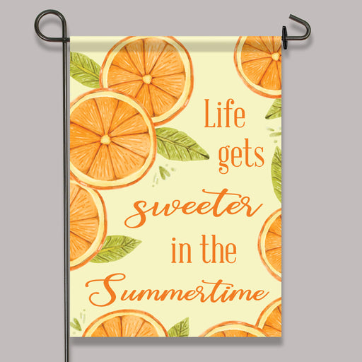 orange slice themed garden flag printed with "Life gets sweeter in the summertime"