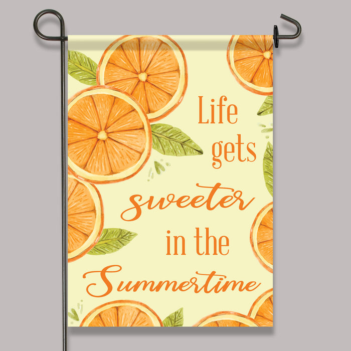 orange slice themed garden flag printed with "Life gets sweeter in the summertime"