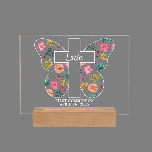 Decorative cross with a floral patterned butterfly on a gray background