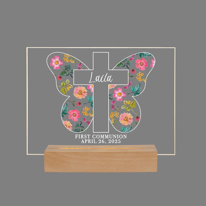 Decorative cross with a floral patterned butterfly on a gray background