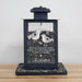 black metal bird feeder engraved with a Winter Wishes poem, a graphic of two birds, and personalized with a family's last name