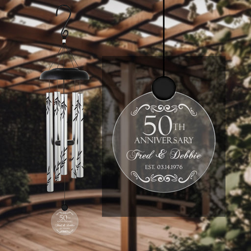 anniversary gift solar wind chime with years wedding date and name engraved hanging in a garden gazebo