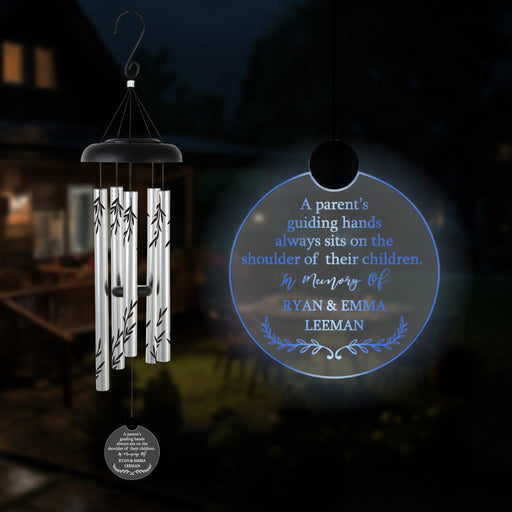 Hanging wind chime with engraved memorial message for loss of parents in the dark