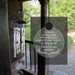 Parents memorial solar wind chime with a personalized message on a blurred outdoor background