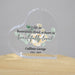 Heart-shaped glass plaque with floral design and text on a wooden surface.