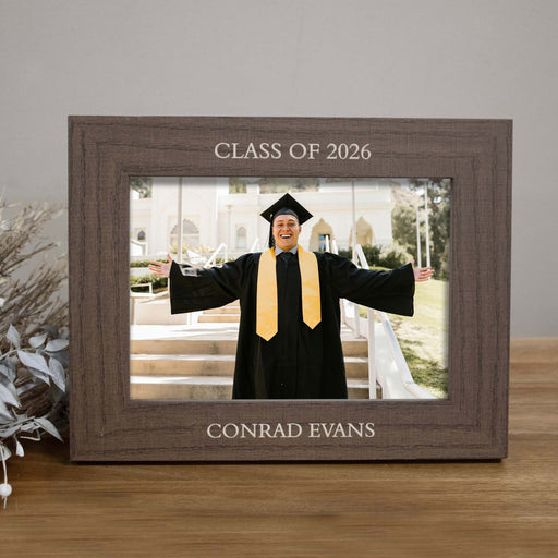 Graduation photo frame with 'Class of 2026' and 'Conrad Evans' text, displaying a graduate in cap and gown.