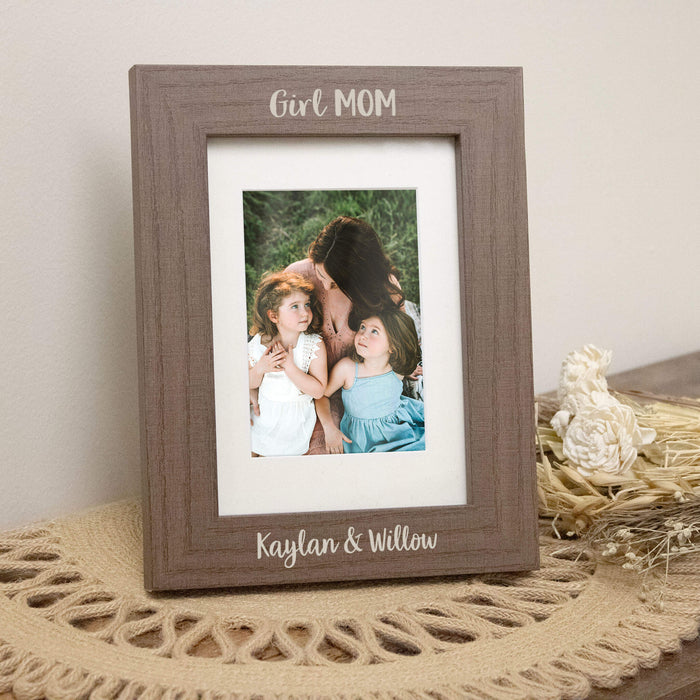 Brown wooden vertical photo frame with a picture of a woman and two children