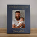 Black photo frame with a father and child photo, text 'Happy first Father's Day 2025' and 'I love you, daddy' on a wooden surface.