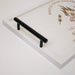Black handle on a white tray with text and graphics