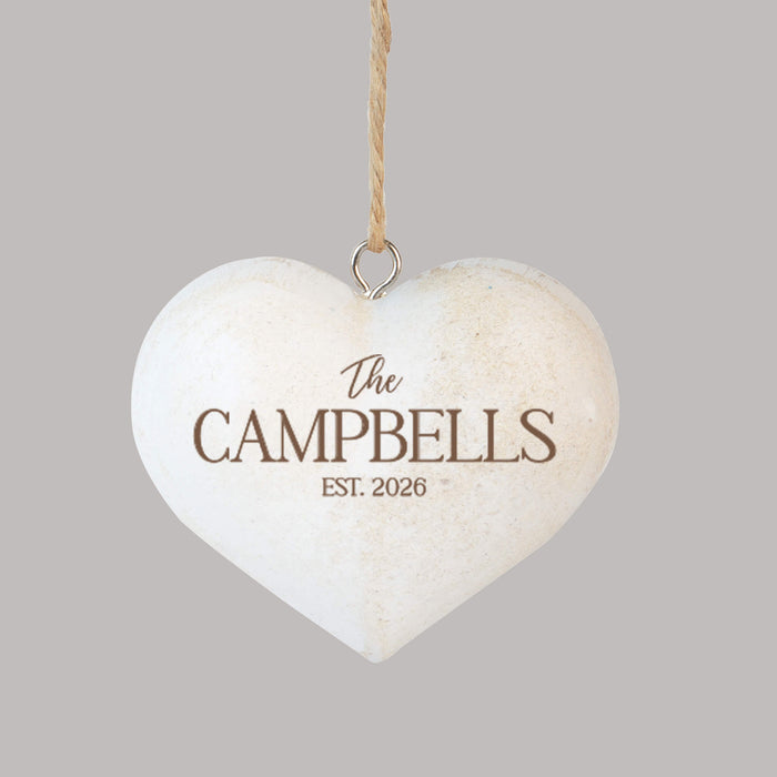 wooden heart Christmas ornament engraved with a couple's last name and established year
