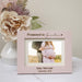 Pink picture frame showing a couple having a baby, engraved with "Promoted to Grandma"