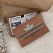 Personalized wooden Christmas-themed card game gift box with two playing cards visible inside, styled on a white faux-fur surface with burlap and dried flowers.