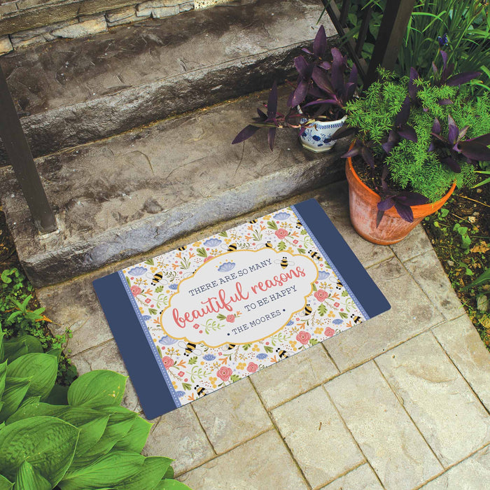 Decorative doormat with motivational quote on a stone step outdoors