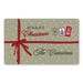 A rectangular holiday doormat with a sage green background, white polka dots, a red ribbon bow across the center, and the text 'MERRY Christmas' and 'The Cranstons,' plus small postage-style Christmas illustrations.