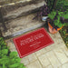 red and white welcome mat for realtor to display at open house with name and phone number