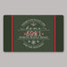 A rectangular holiday-themed door mat with a dark green background, red side panels, and white decorative text reading “There’s no place like home 5921 North Maple Road for the holidays,” centered on a light gray background.