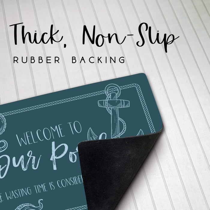 Door mat with anchor design and text on a white background