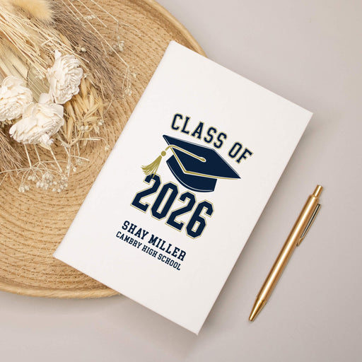 Graduation-themed notebook with 'Class of 2026' design on a neutral background