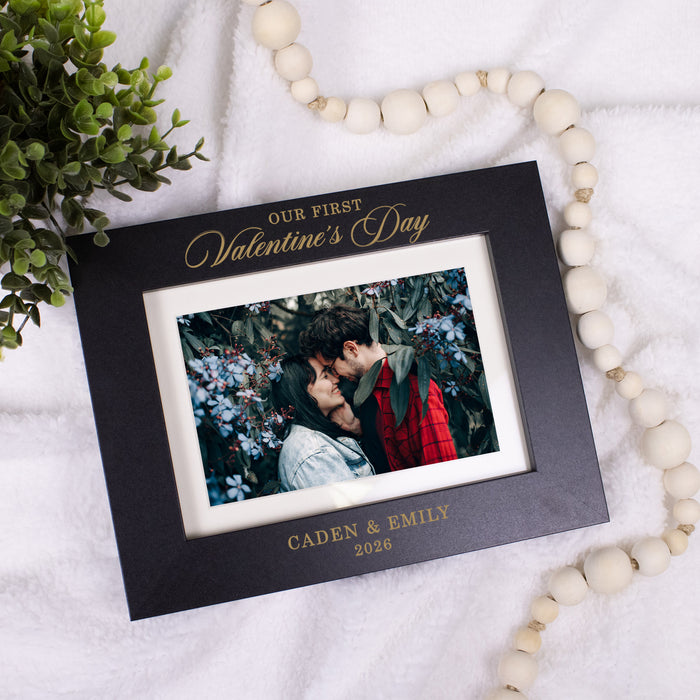 Black picture frame for couple's first valentines day together engraved with their names and the year