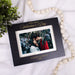 Black picture frame for couple's first valentines day together engraved with their names and the year