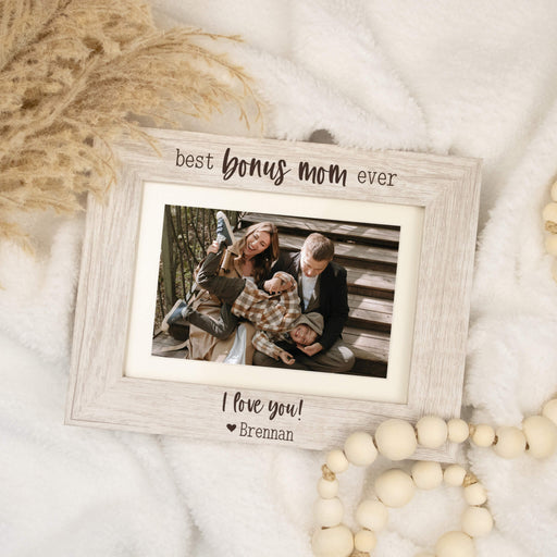 Rustic white wooden photo frame with a family photo and 'best bonus mom ever' text