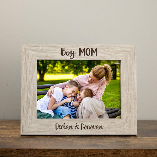 Personalized rustic white photo frame with a family picture and engraved with "Boy Mom" and children's names