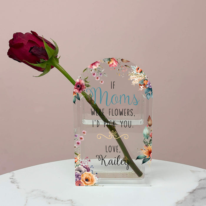 A flower vase with a red rose inside decorated with a Mom design