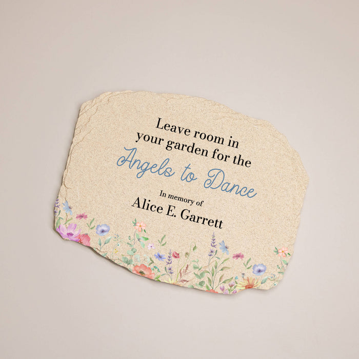 Decorative garden plaque with floral design and text on a beige background