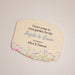 Decorative garden plaque with floral design and text on a beige background