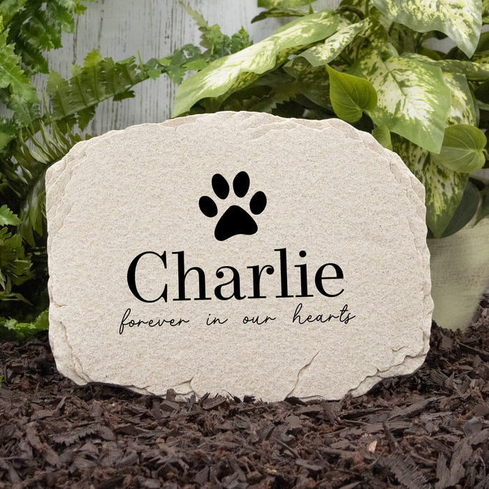 Dog Memorial Garden Stone Customized with Pet's Name, a dog paw print, and the saying 'forever in our hearts'
